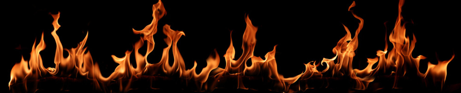 Real fire flames isolated on black background with glowing orange heat, dramatic burning texture, abstract energy, danger, heatwave, ignition, wildfire, and hot flame banner design.