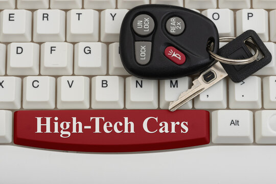 High-Tech Cars text with auto keys on a white computer keyboard for automotive technology