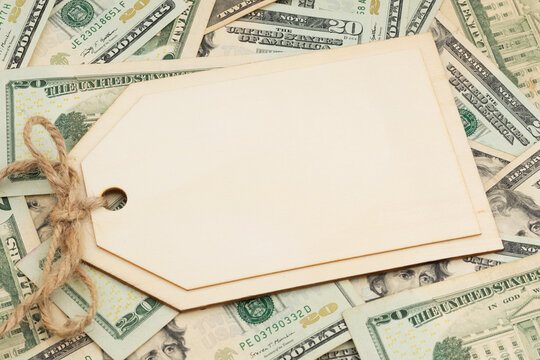 Blank price tag on twenty dollar bills for cost and pricing
