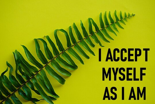 Motivational quote, i accept myself as i am. Self-inspiration shapes personality. Learning concept. Self-development spirit words. Life-changing guide. Yellow background and a kind of fern leaf