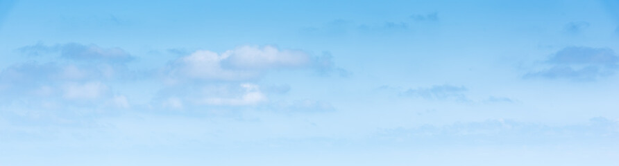 Obraz premium Blue sky with few white clouds on a sunny summer day