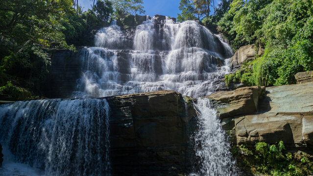 Aerial view of Cigangsa Waterfall with multi-tiered cascades and lush tropical greenery Sukabumi, West Java, Indonesia.