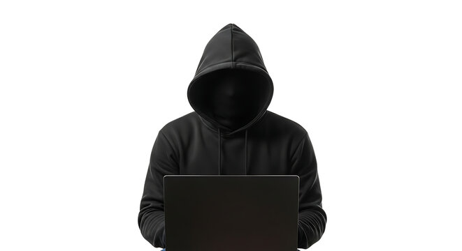 A person in a black hoodie is typing on a laptop computer.