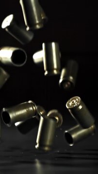 Bullet casings are pressed on the table. Filmed on a high-speed camera at 1000 fps. High quality FullHD footage