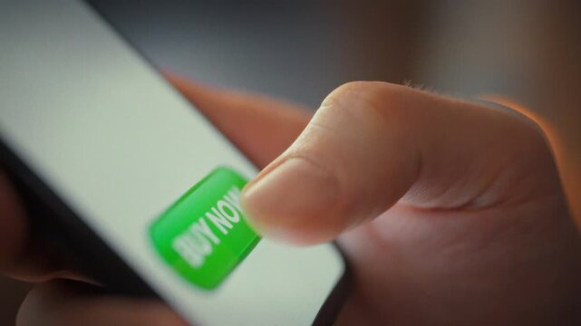 At digital checkout station, man taps the pay button on his smartphone to complete an online shopping purchase. The screen instantly confirms payment, highlighting how modern tech streamlines buying