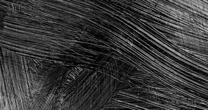 Black Paint Smear and Mix Stop Motion. Stop-motion sequence of thick glossy black paint being smeared, dragged and mixed across a dark surface.