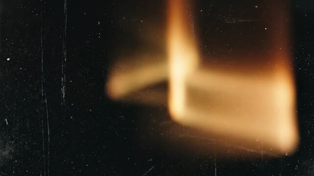 Retro light leak overlay with scratch dust, grain and blurred flare on deep black background, cinematic analog texture for posters, album covers and editorial layouts, warm luminous streaks,