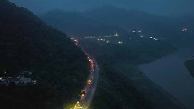 Aerial night view of massive traffic jam on Himalayan mountain road in Himachal Pradesh.