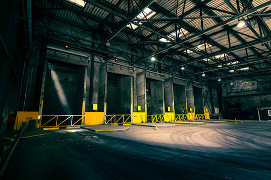 Empty industrial warehouse interior with loading bays