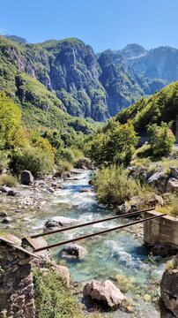 Pristine alpine river flowing through Theth National Park in the Albanian Alps, a popular destination for nature lovers, hikers, and adventure seekers in Albania