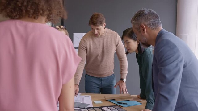 Group of architects discussing project during meeting