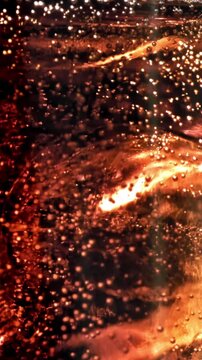 Bubbles in a glass of cola with ice. Filmed on a high-speed camera at 1000 fps. High quality FullHD footage