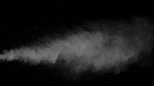 Hot Steam Plume Rising on Black. Slow-motion of hot steam powerfully rising from below, forming a tall turbulent column that expands, gradually dissipates into fine sparkling particles.