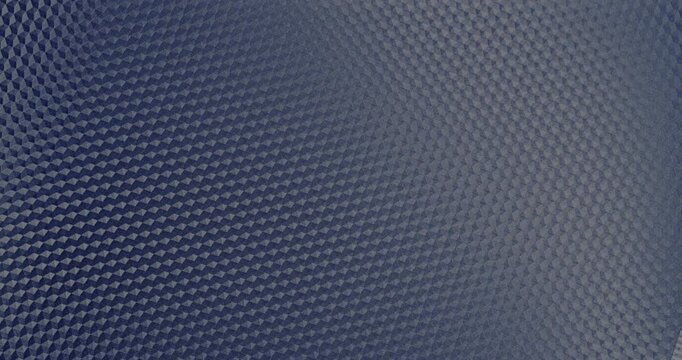 Blue Geometric Texture Seamless Rotation. Smooth continuous rotation of vibrant blue geometric diamond pattern texture. Hypnotic seamless loop with subtle light reflections gliding across the surface.