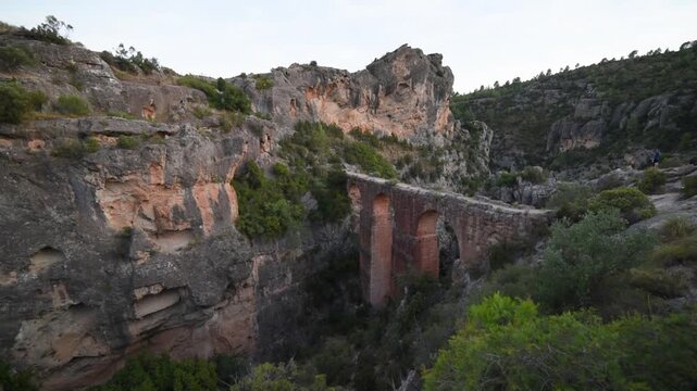 Dramatic Ancient Roman Aqueduct Pe&ntilde;a Cortada in Chelva Spain, Historic Landmark Nature Video