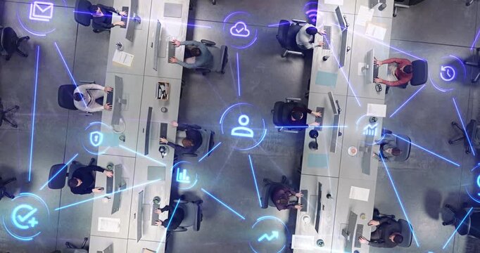 Top Down View of Open Plan Office With Diverse Staff Working at Computer Stations as Linked Visualization Layer Appears, Luminous Blue Beams and Icons Reflect Email, Data Protection and Tracking.