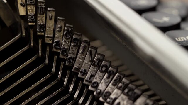Close view of typewriter keys showing letters and numbers in an office setting during the day