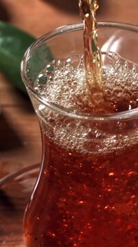 Turkish tea is poured into a glass. Filmed on a high-speed camera at 1000 fps. High quality FullHD footage