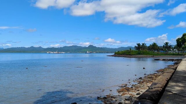 Scenic coastal view of ocean and rugged mountains in capital city Suva on tropical island Viti Levu in Fiji, South Pacific