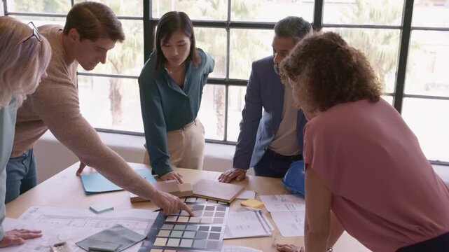 Architects and interior designers reviewing plans