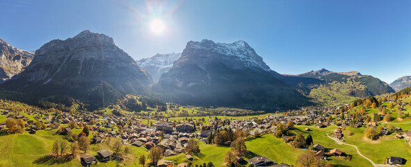 Obraz premium Switzerland Autumn landscape of Grindelwald village aerial panorama with Eiger mountain peak in background. Grindelwald, Bern, Switzerland.