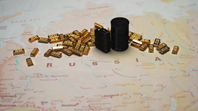 Fuel canister and oil barrel with gold bars on Russia map wealth concept.
