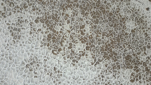Aerial view of the intricate hexagonal salt crust patterns and textures of Salinas Grandes, Tumbaya, Jujuy, Argentina.