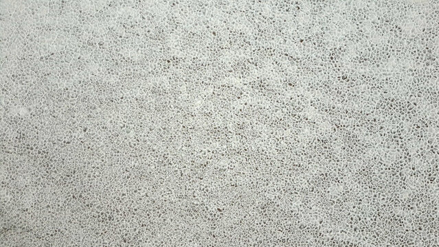 Aerial view of the hexagonal salt crust patterns on the Salinas Grandes salt flats with white crystalline textures in Tumbaya, Jujuy, Argentina.