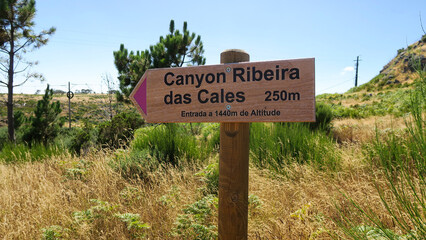 Fototapeta premium Ribeira das Cales, Madeira, Portugal. Signpost of the canyon hiking trail Ribeira das Cales