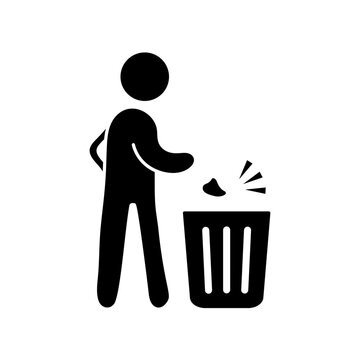 Silhouette of a man throwing trash into bins garbage
