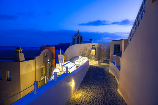 Blue hour lane and old church in Oia