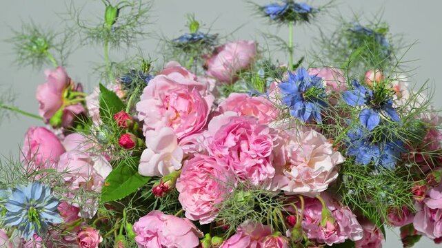 Floral arrangement with small pink roses, slow rotation