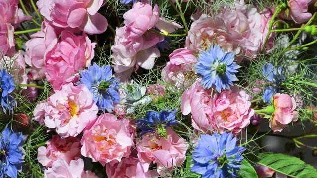 Floral arrangement with small pink roses, slow rotation