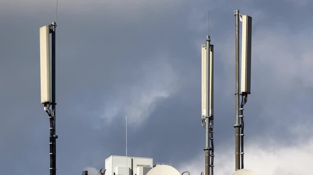 Communication antennas on a building rooftop