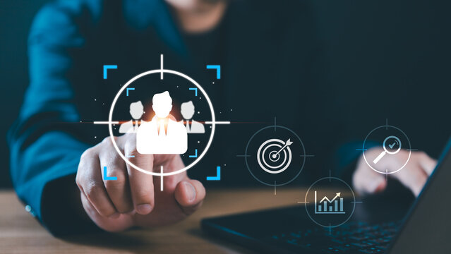 Professional HR recruitment and talent acquisition concept. Businessman hand pointing at target icon to select candidate for executive leadership, human resources management, and career growth