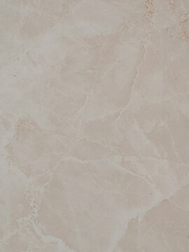 High resolution natural beige marble stone texture background with subtle organic veins and soft neutral tones