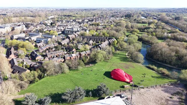4K aerial video showing Oxford city centre with historic spires and stone buildings in bright natural daylight.