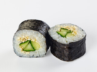 Two cucumber and sesame maki sushi rolls isolated on white background © Andrei Starostin