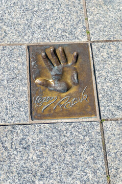 Miedzyzdroje, Poland - May 3, 2026: Handprint and signature of Cezary Andrzej Pazura at Walk of Fame, Promenade of Stars (Promenada Gwiazd). Cezary Pazura is a Polish actor.