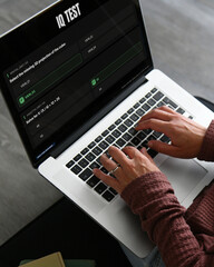 Fototapeta premium A professional woman completes a digital IQ test to identify unique cognitive strengths, emphasizing the need for neurodiversity, ADHD recognition, and giftedness integration in the workplace.