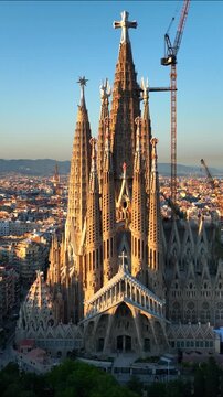 vertical drone video of Barcelona skyline at sunset, Barcelona is the capital of Catalunya, travel in Barcelona, Spain
