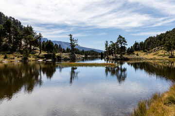 Obraz premium Beautiful Achard lake in the Chamrousse resort, Belledonne Massif in the French Alps
