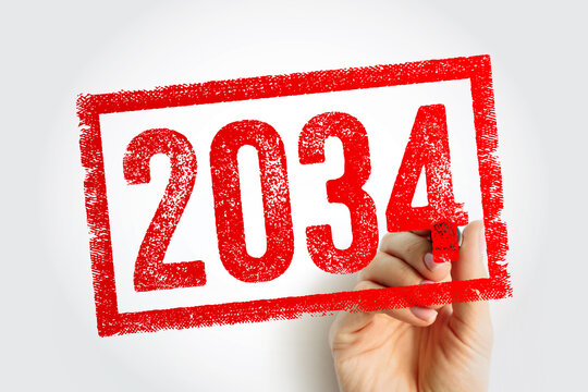 2034 number text inside textured rectangle stamped by hand holding marker. Future date concept for business planning and upcoming calendar events.