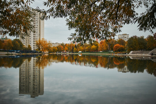 View of landscaped embankment around large Konkovsky pond. Konkovo District, Moscow