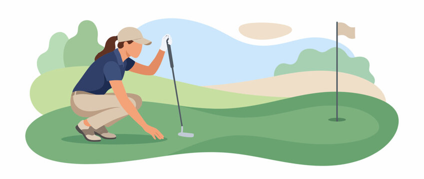 Female golfer crouching on the green to read the putting line.