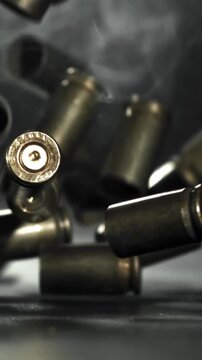 Bullet casings are pressed on the table. Filmed on a high-speed camera at 1000 fps. High quality FullHD footage