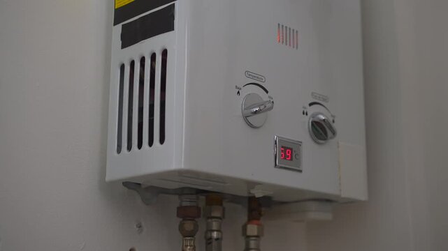 Home gas tankless water heater igniting flame and heating water. Uncompressed 24 bit high quality sound. Professional audio recording of household system. Energy efficiency and home technology concept