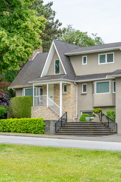 Suburban Family Home with Landscaped Front Yard in Vancouver