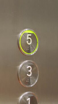 Pov video of a man pressing a five button in an elevator