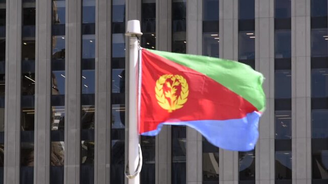 The Eritrean flag on a flag pole at Toronto City Hall&rsquo;s Nathan Phillips Square.